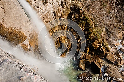 Top view of rapid waterfall stream flowing down the high rock in Martvili canyon on autumn day Stock Photo