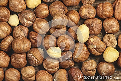 Top view of raw and peeled roasted brown hazelnuts pie Stock Photo