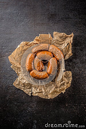 Top of view raw small cocktail sausages on cutting board Stock Photo