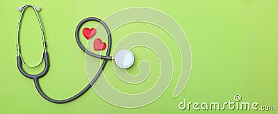 Top view red heart white stethoscope green doctor table. medical healthy concept Stock Photo