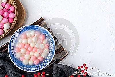 Top view of red and white tangyuan in blue bowl on white background for Winter solstice Stock Photo