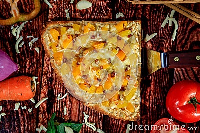 Top view reversed photo of delicious sweet and spicy pizza slice with pineapple, mango, hot sausage and mozzarella cheese Stock Photo