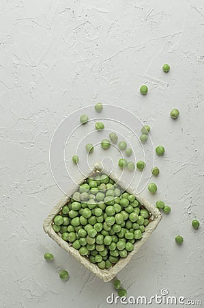 Top view Ripe pods of green peas on light concrete background. Fresh vegetables. Legumes. Flat lay Stock Photo