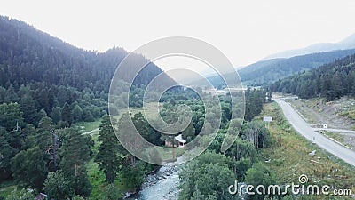 Top view of the river in a small settlement. Mountain countryside small houses in the village beautiful nature and Stock Photo