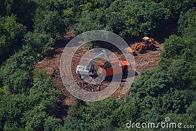 Top view of the road construction among the fores Stock Photo