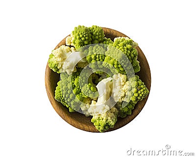 Top view. Roman cauliflower on wooden bowl isolated on white. Roman cauliflower close up. Fractal texture of romanesco broccoli. Stock Photo