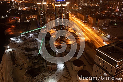 Top view of the roof of night newly built business center inmodern residential quarter with futuristic illumination. Editorial Stock Photo