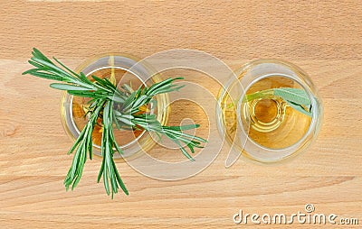 Top view of rosemary tea in glass cups on wooden table Stock Photo