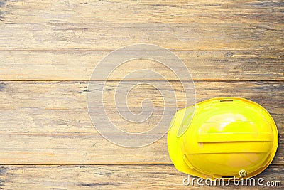 Top view Safety Engineer Helmet on brown wooden table background Stock Photo