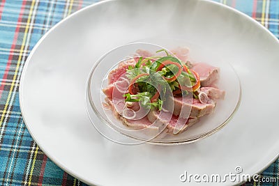 Top view salmon sashimi on ice with dry ice smoke, Japanese food Stock Photo