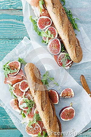 Top view sandwich prosciutto mascarpone cheese figs wooden table Stock Photo