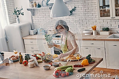 Top view of senior woman in apron Stock Photo