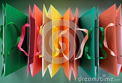 Top view of Paper shopping bags with handles on green background. Stock Photo