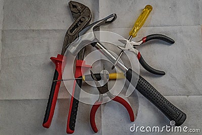 Top view of a set of DIY tools (pliers, hammer, wire cutters, and screwdrivers) Stock Photo
