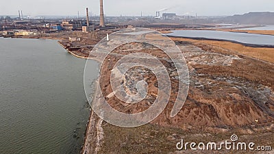 Top view on settling tanks of Azovstal. Mariupol. Sunset on Azov sea Stock Photo