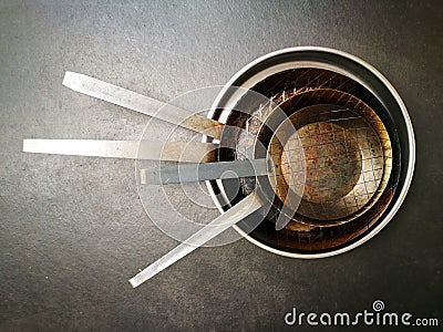 Top view shot of stacked rusty aluminum pans Stock Photo
