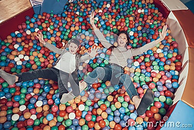 Top view. Smiling mom and son in pool with balls Stock Photo