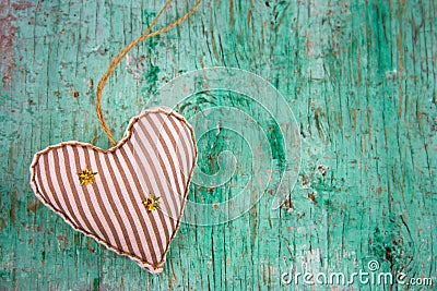 Soft toy in a shape of heart on a mint green shabby wooden background copy space Stock Photo