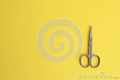 Top view of special nail scissors for babies on a yellow background Stock Photo