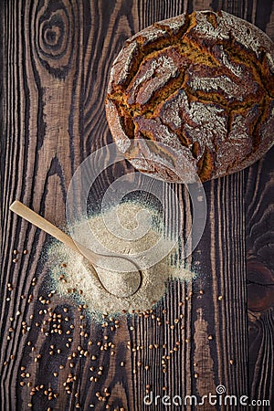 Top view spoon with buckwheat flour and bread Stock Photo