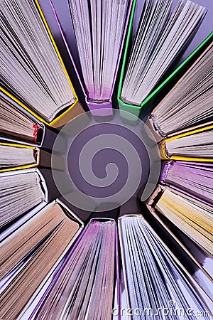 top view of stack of colored books in circle Stock Photo