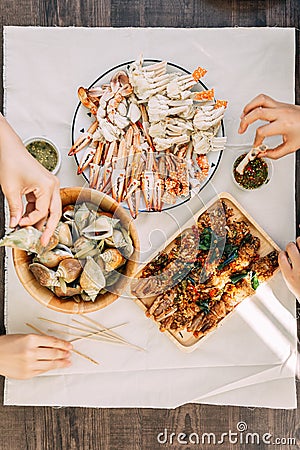 Top view of steamed Flower Crabs and Giant Mud Crabs with separated parts of steamed crab such as claw meat and body. Stock Photo