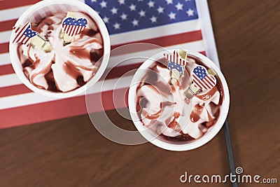 Top view of strawberry sundaes on top of the America flag on a wooden table Stock Photo