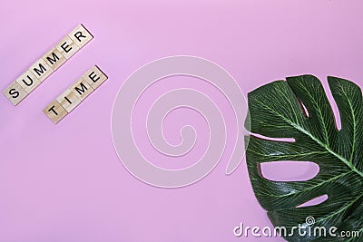 Top view summer time lettering of alphabet wooden blocks on pink background Stock Photo