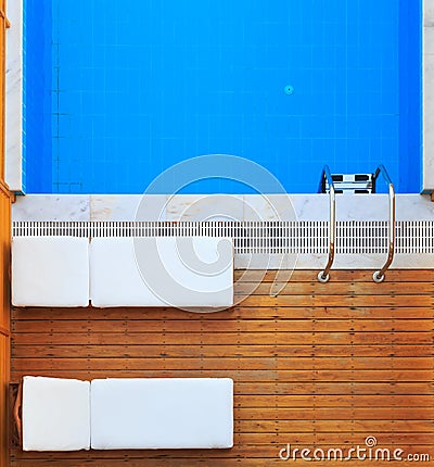 Top view of sunbeds near private pool Stock Photo