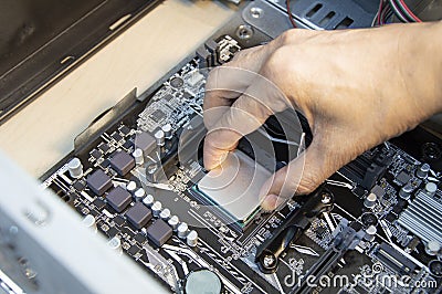 top view technician inserting cpu, computer assembler Stock Photo