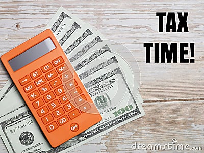 Top view text TAX TIME with calculator and fake money Stock Photo