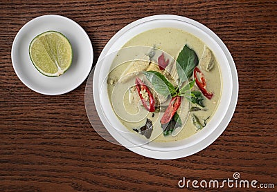 Top view Thai food chicken green curry on wooden table Stock Photo