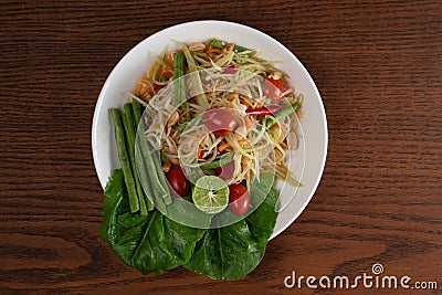 Top view Thai food rice noodle papaya salad on wooden table Stock Photo