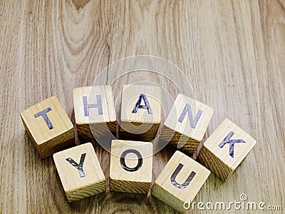 Thank you word wooden block on wooden background Stock Photo