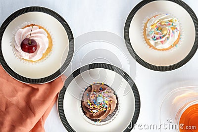 top view three cupcakes with cup of tea Stock Photo