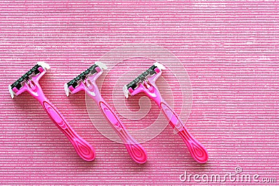 Top view of three disposable pink shaving razors Stock Photo