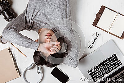 Top view of tired businessman at workplace with copy space Stock Photo