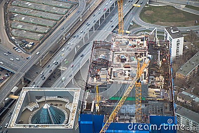 Top view to construction site of erecting skyscraper,futured office-tower.Part of big industrial project Editorial Stock Photo