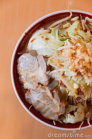 Top view of Tonkotsu chashu ramen topping with cabbage, bean sprout and garlic served in oversized portion Stock Photo