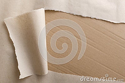 Top view of torn wrapping paper and side of paperboard box.Empty space for text.Opening parcel Stock Photo