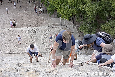 Top view of tourists climb the Pyramid Nohoch Mul along the guiding rope at the Mayan Coba Ruins, Mexico Editorial Stock Photo