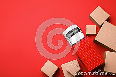 Top view of toy truck with boxes on background. Logistics and wholesale concept Stock Photo