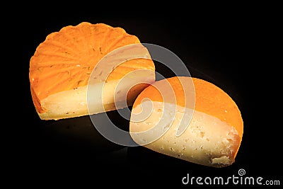top view of two halves of different hard yellow cheese heads Stock Photo