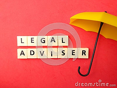 Top view umbrella and toys word with text LEGAL ADVISER Stock Photo