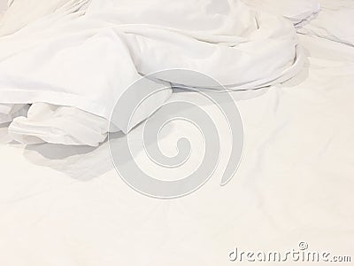 Top view of unmade bedding sheet or white fabric wrinkle texture background Stock Photo