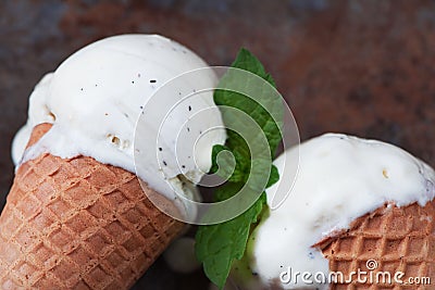 Top view vanilla ice cream in waffle cone with mint leaves on a Stock Photo