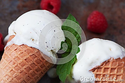 Top view vanilla ice cream in waffle cone with mint leaves on a Stock Photo