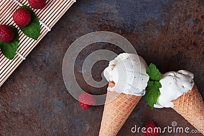 Top view vanilla ice cream in waffle cone with mint leaves on a Stock Photo