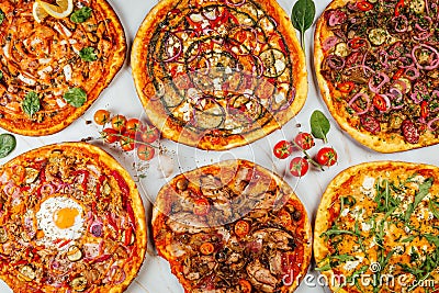 Top view of a variety of tasty pizzas with spices Stock Photo