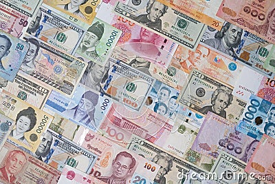 Top view of Various of international banknote include dollar Yuan Won Baht Peso for currency exchange and money transfer concept Stock Photo